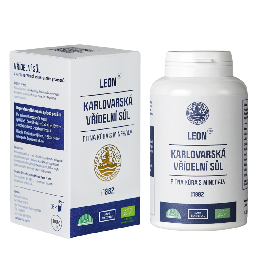 Karlovarská vřídelní sůl LEON 100 g v bílé dóze vedle papírové krabičky.